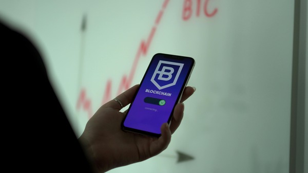 Smartphone displaying a blockchain application connecting screen